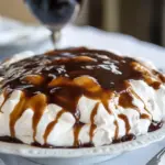 Homemade Coconut Pavlova with Pudding and Caramel Sauce photo
