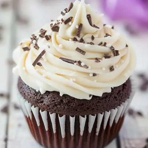 Homemade Dark Chocolate Cupcakes with White Chocolate Frosting photo