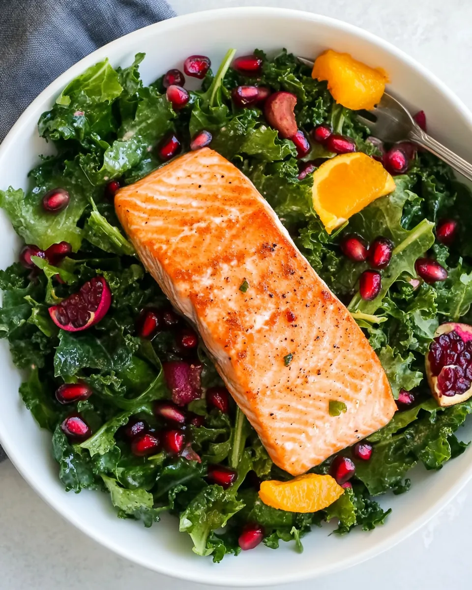 Homemade Kale Salad Recipe With Salmon, Pomegranate, And Orange-Coconut Vinaigrette photo