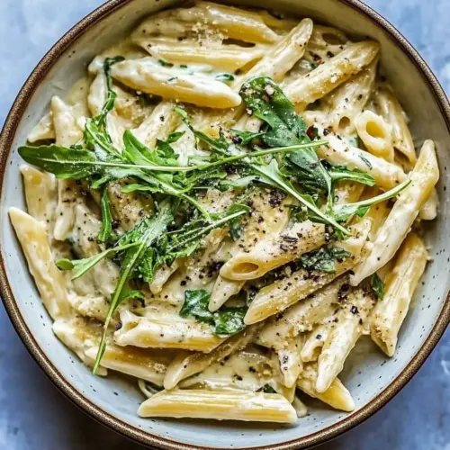 Best One Pot Creamy Penne Alfredo with Spicy Arugula. image